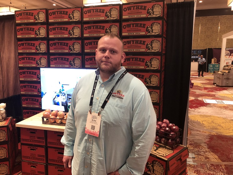  Blake Branen, director of marketing for Owyhee Produce, Nyssa, Ore., on the expo floor at The Packer's 2022 GOPEX show. Owyhee Produce now offers both whole and processed organic onions, he said.  "We can utilize our whole entire organic crop from start to finish," he said. 