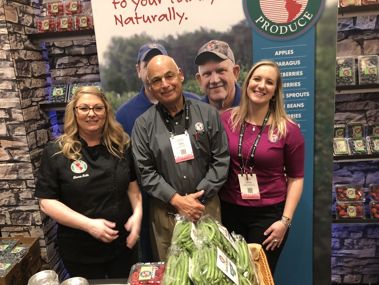  From left to right: Sharon Robb, national marketing manaager at North Bay Produce, Traverse City, Mich., Rod Bangert, business relationship manager, and Sarah Quackenbush, sales and export representative. Quackenbush said the company was highlighting organic strawberries, a new item for the company, sourced from Mexico. North Bay Produce also is increasing sales of all its organic items, notably French beans, she said.