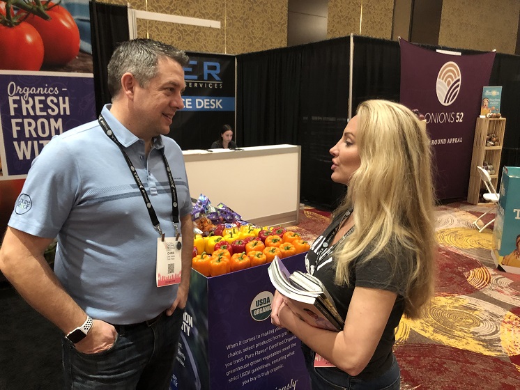  Chris Veillon, chief marketing officer with Pure Hothouse Foods, Leamington, Ontario, visits with Wendy Reinhardt Kapsak, president and CEO of the Produce for Better Health Foundation.
