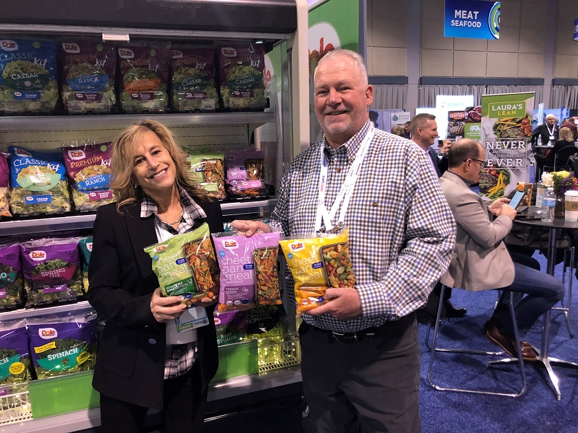  Susan Brown and Mark Croft with Dole are pictured. Dole was promoting its new Sheet Pan Meals, available in limited markets now. Dole also is introducing several new flavors of its Chopped Kits.
"What makes them popular is they have the dressing and accessories like sunflower seeds, bacon, blue cheese crumbles, crispy strips, tortillas or crispy onion seasoning packets," Brown said. "You just put them in a bowl, mix it, add meat or whatever."
