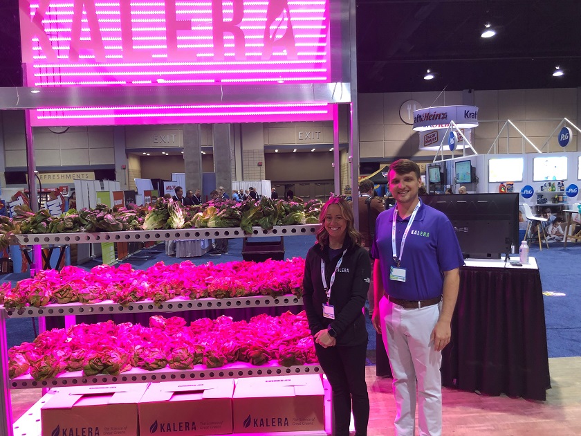  The futuristic Kalera booth at the showcase attracted attention with an impressive light display simulating its indoor growing technology. Pictured are John Center, marketing manager, and Sarah Noernberg, director of sales.
