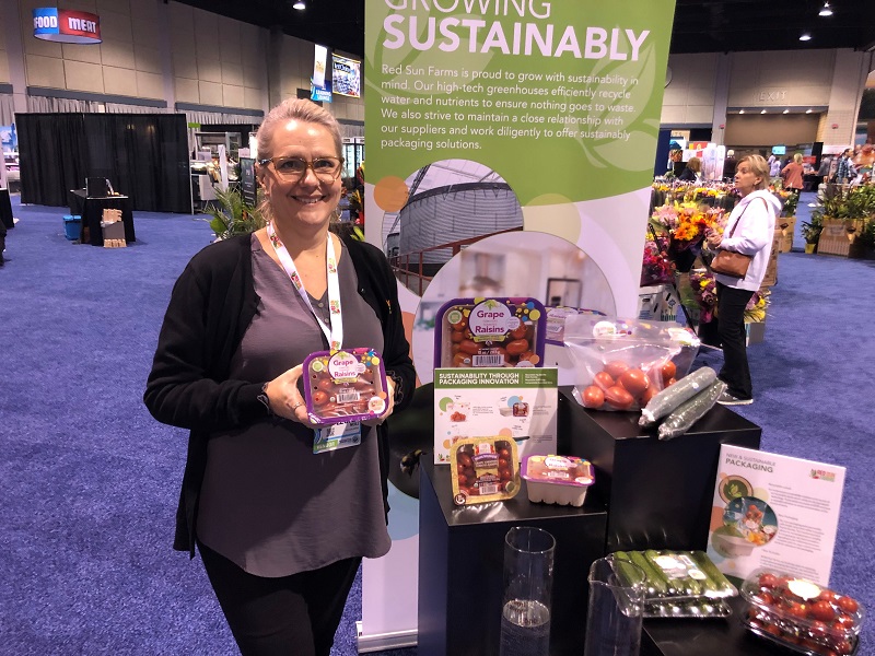  Leona Neill, director of marketing and packaging for Red Sun Farms, Kingsville, Ontario, displays the firm's compostable pack, fitted with a recyclable seal. 