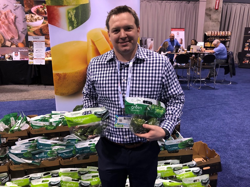  Mark Trapp, key account manager for Robinson Fresh, displayed the marketer's new packaged vegetable line, which includes two-count green bell pepper, a two-count cucumber and a 10-ounce jalapeno pack.