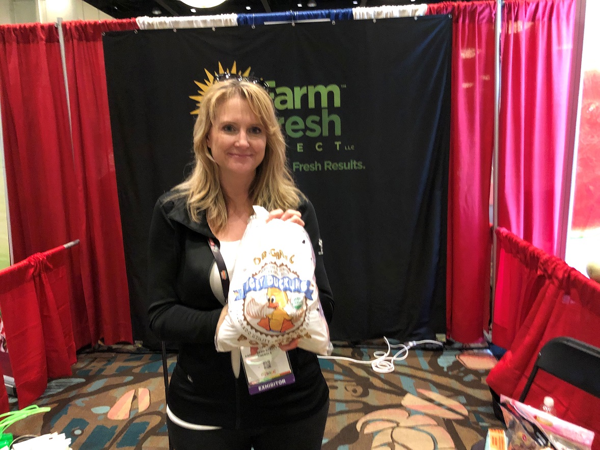 Lonnie Gillespie, chief organic officer for Farm Fresh Direct of America, Monte Vista, Colo., displays the company's Ugly Duckling pack, which features No. 2 organic potatoes. The pack has a lower price point that is very similar to conventional potatoes, Gillespie said.