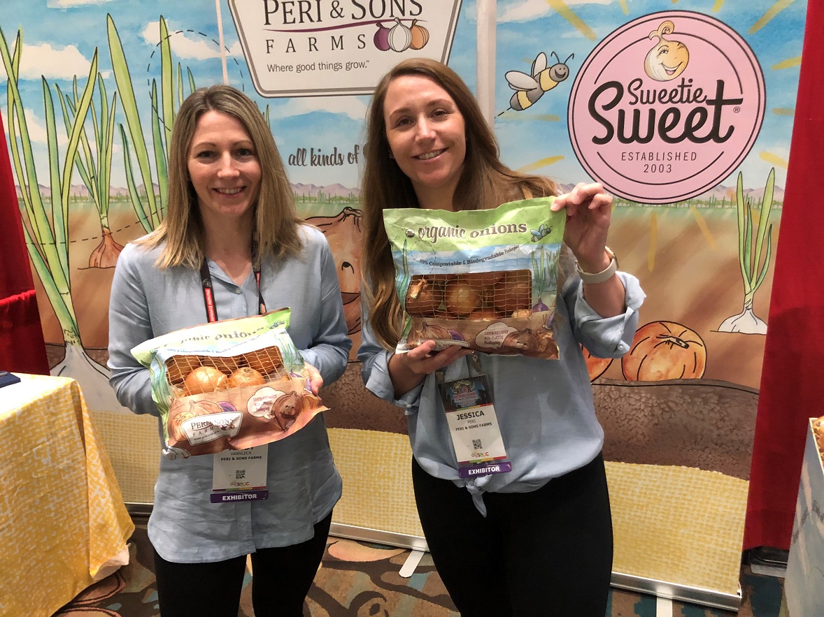  Mindy VanVleck, sales representative, and  Jessica Peri, retail sales manager for Peri & Sons Farms, Yerrington, Nev., display the company's all-paper "earth" bag. The pack features a bamboo mesh screen, and is enjoying good retailer and consumer response, Peri said.