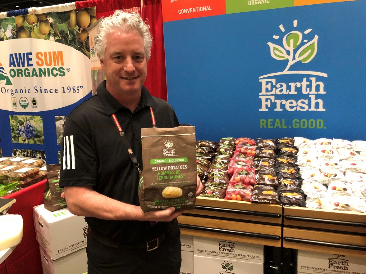  Dan Martin, chief operating officer for EarthFresh Foods, Burlington, Ontario, displays the company's completely compostable bag option. Martin said even the mesh on the bag is compostable, and the pack can help retailers meet their sustainability goals.