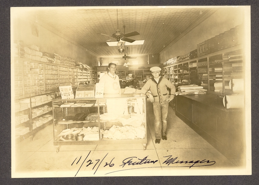  Brothers Ike Basha (from left) and Eddie Basha Sr. stand in a Boston grocery store. The pair opened their own Bashas'-branded store in 1932, in Chandler, Ariz.