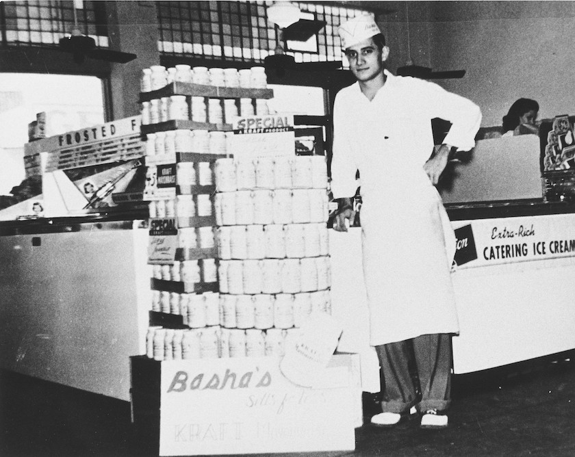  Fred Felix stands inside a Bashas' supermarket in the early- to mid-1900s.