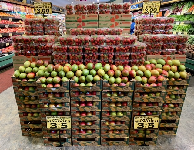  Great use by Charlton of cardboard shipping boxes to make a wow-worthy strawberry and mango display.