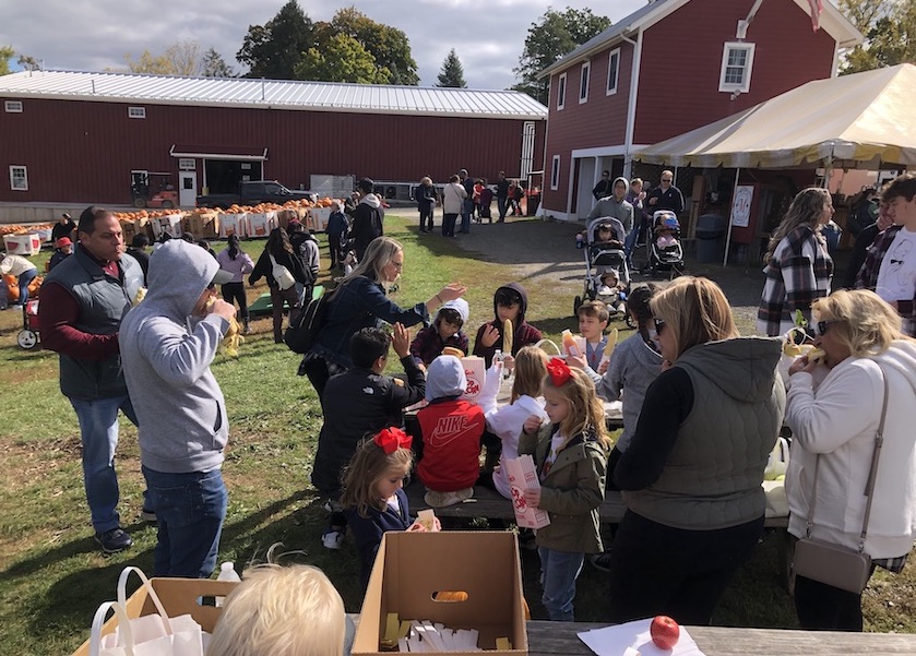  People enjoyed corn on the cob, popcorn and hot dogs after they picked apples.