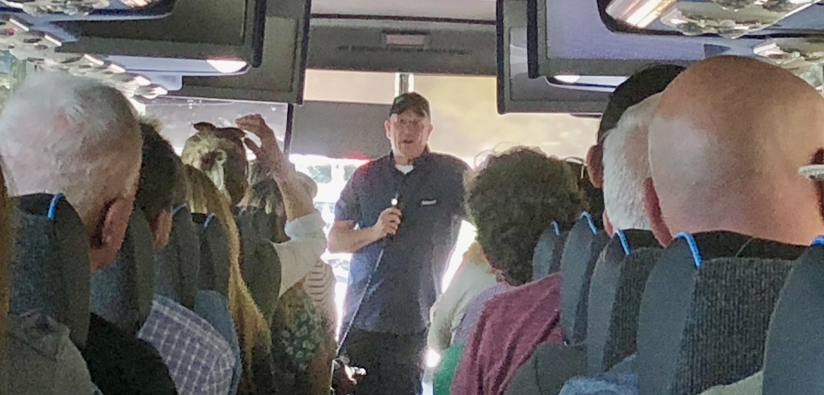  Brent Demarest, senior team leader of operations at Whole Foods Market, introduces himself to the tour bus riders.