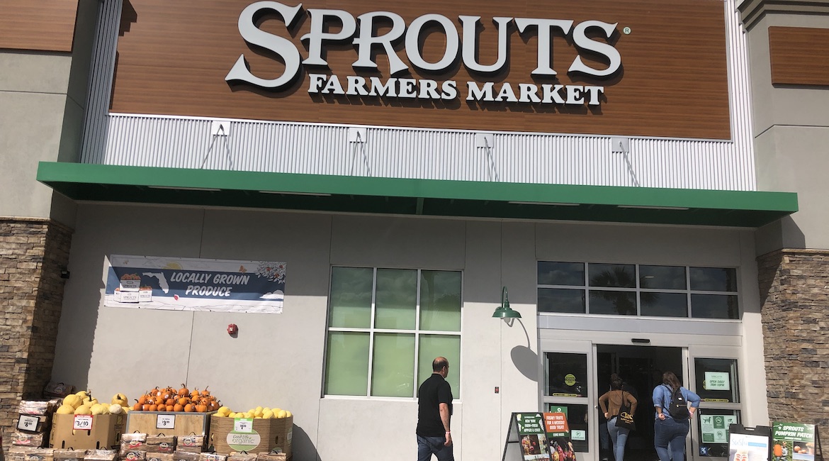  Sprouts Farmers Market features pumpkins outside its store, just past the first glass doors, and then "freaky" fruit for Halloween promotions.