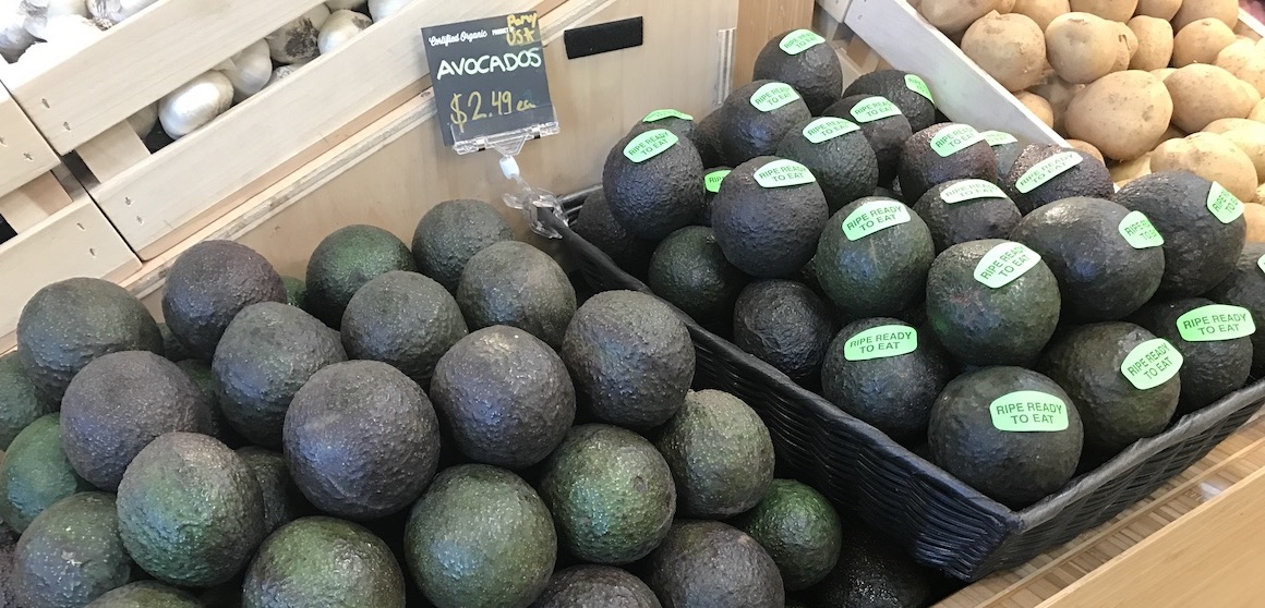  "Ripe and ready to eat" stickers can help shoppers know which avocado to buy.