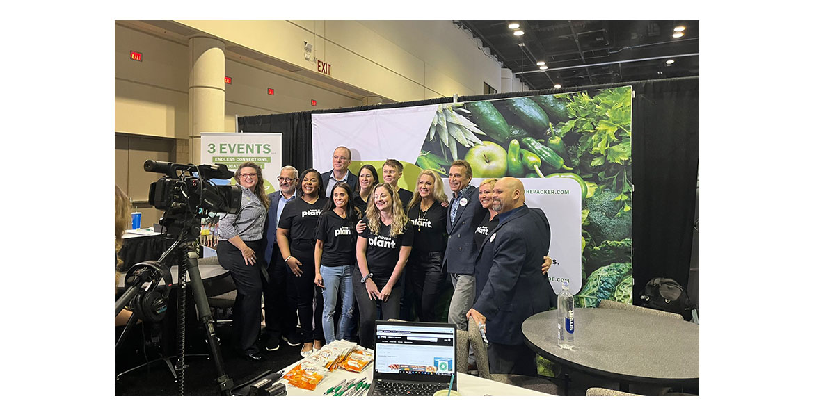  CarrieAnne Arias, vice president, Naturipe Farms; Bil Goldfield, director of corporate communications, Dole; friends of the Have a Plant movement and others celebrate the recent 2022 Produce Marketer of the Year award. 