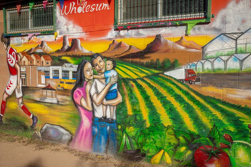  A new mural highlights themes of community, growth, family and agriculture. 
