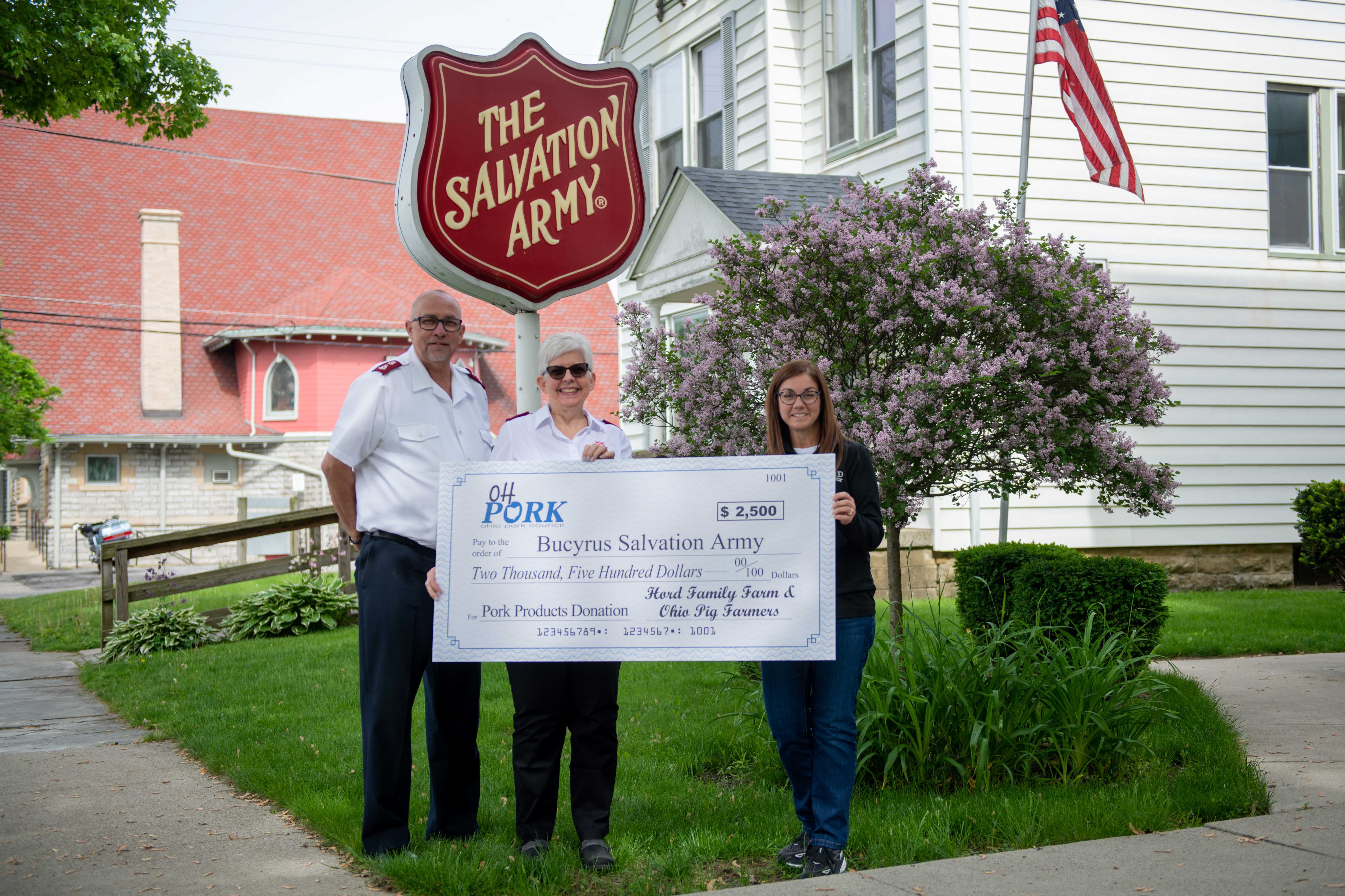  Janel Hord, from Hord Family Farms (far right), presented a check for $2,500 to Major Tom Grace and Major Debbra Grace at The Salvation Army in Bucyrus, Ohio. The organization will use the funds to purchase pork to help supply high-quality protein to those in need in Crawford County.