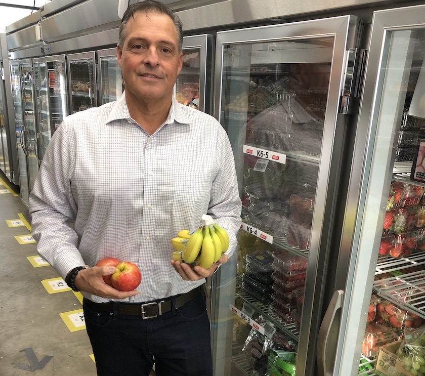 Jay schneider of gorillas u.s. holds apples and bananas