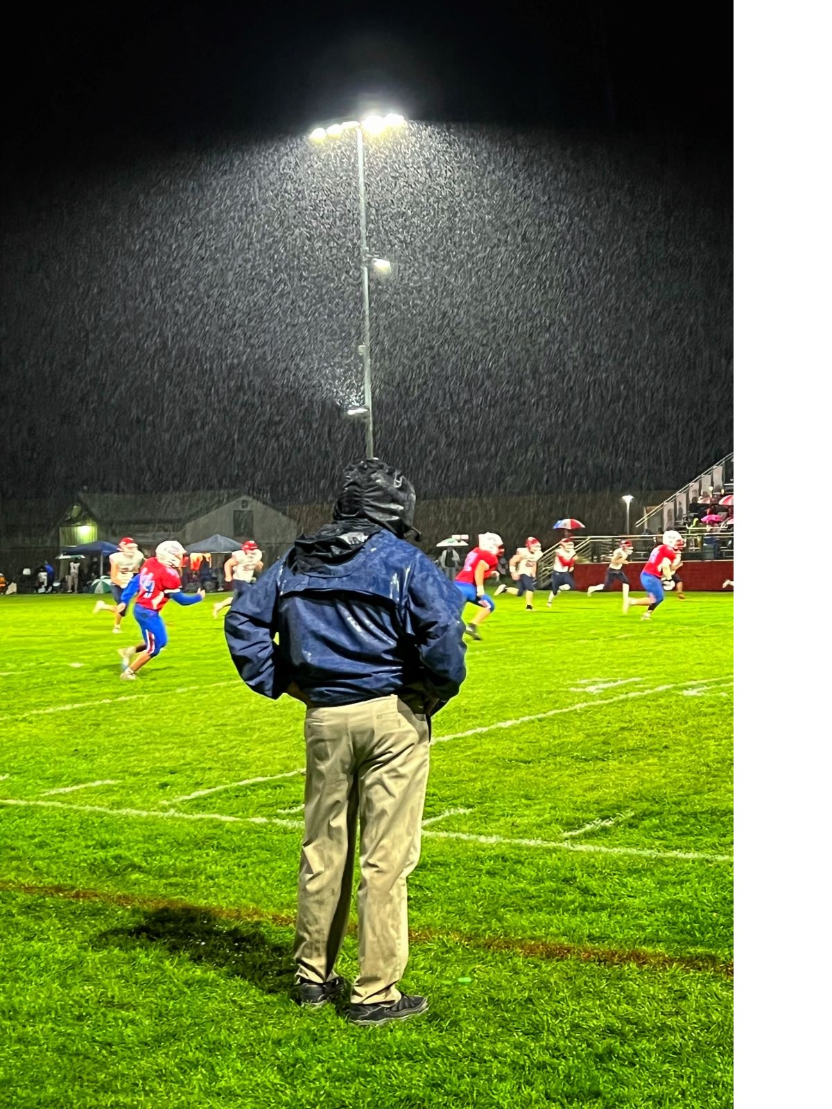 Russ Radtke watches his team in the rain