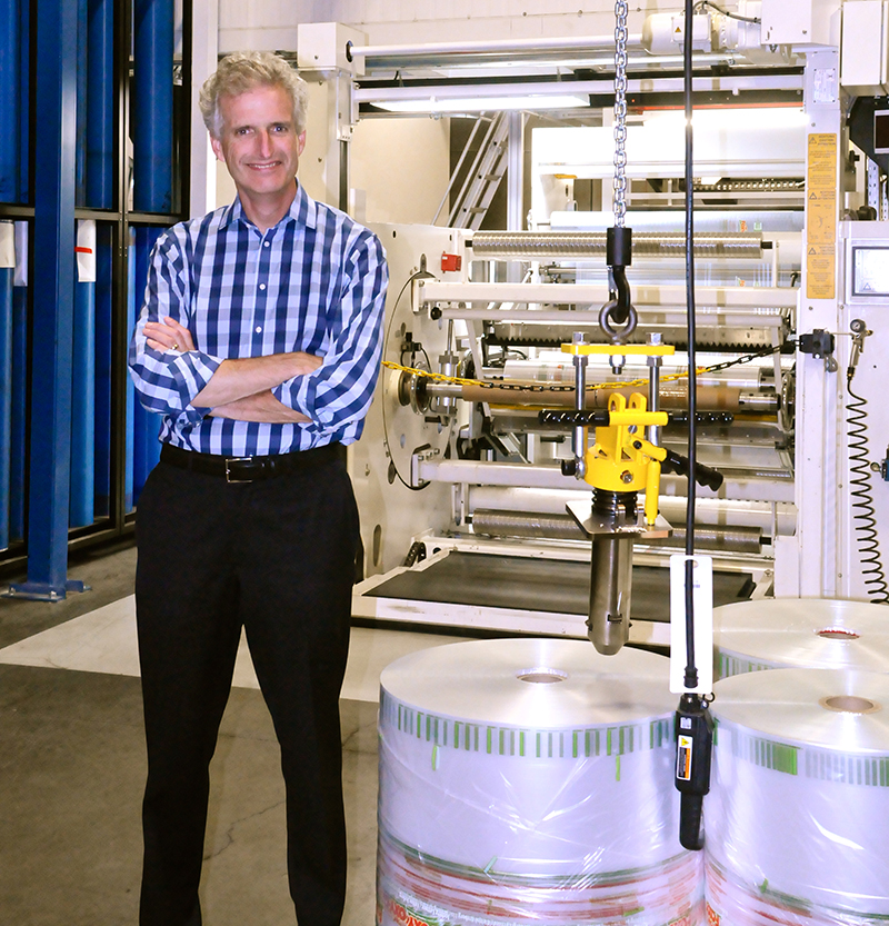 Kevin Kelly standing in manufacturing facility. Photo courtesy Emerald Packaging
