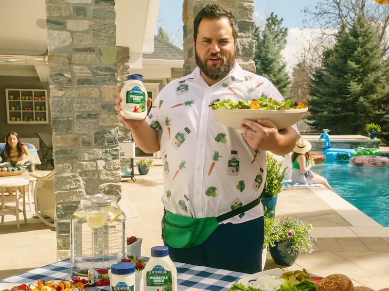 guy by pool holding ranch dressing