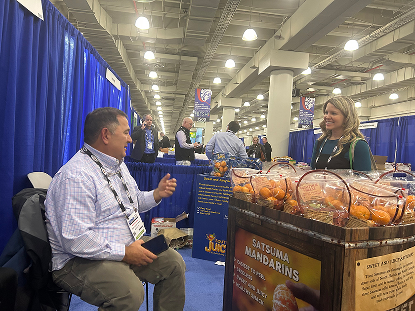 Mark Clikas of Sweet Valley Citrus, Marianna, Fla., and incoming president of the Cold Hardy Citrus Association, chats at the 2022 New York Produce Show with Marissa Oliver-Horton, a freelance New York-based food stylist and private chef, attending on behalf of Babe Farms Specilaties Inc., Santa Maria, Calif.