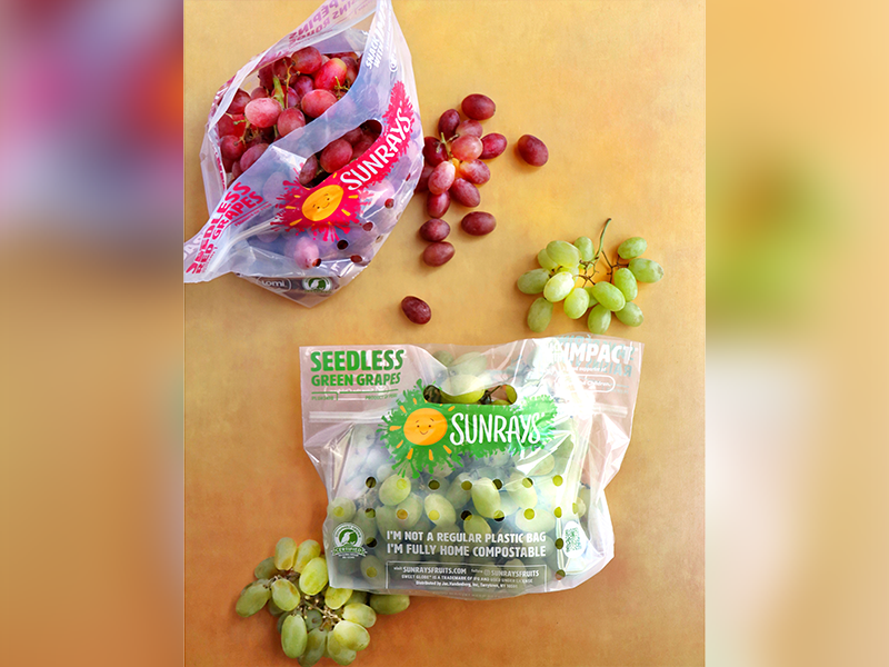 Two resealable bags, each with the Sunrays logo, one containing red grapes and another with green grapes.