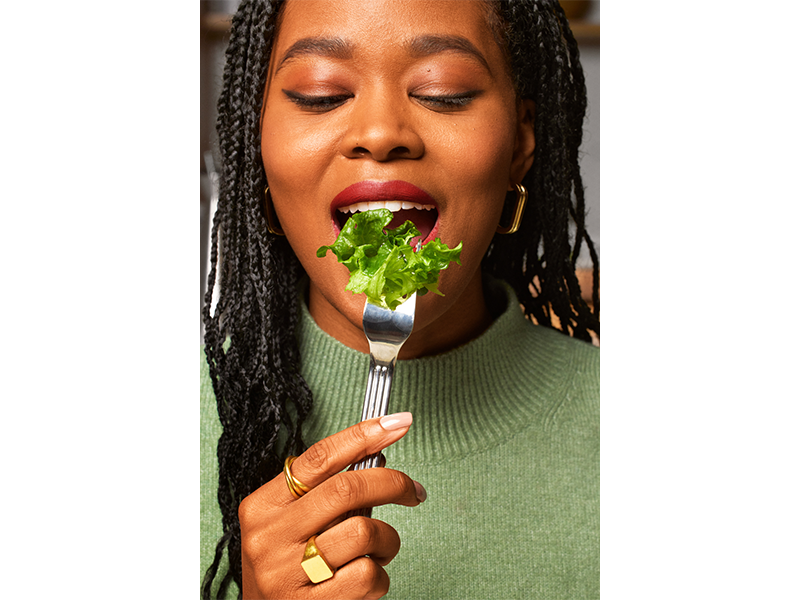 woman tasting lettuce