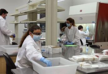 Staff at the Texas A&M Veterinary Medical Diagnostic Laboratory assemble sampling kits for physicians' use.