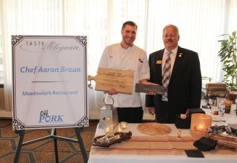 Ohio Pork Council President Dave Shoup presents Chef Aaron Braun with the Chef Par Excellence Award and People's Choice Award. Braun has been awarded the People's Choice Award for two consecutive years.
