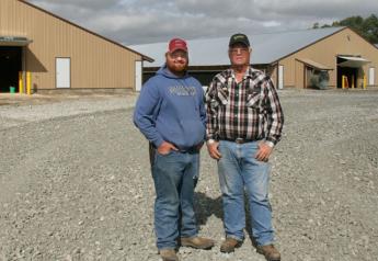 Nebraska farmer Colten Schafersman (left) purchased 100 acres from his grandfather, John Snover, (right) to build two hen houses and one rooster house for pullet production. 