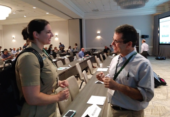 Kari Irvin, deputy director of the Food and Drug Administration’s Coordinated Outbreak Response and Evaluation Network, talks with Cornell University professor Martin Wiedmann after Irvin's presentation on the difficulties of tracing the source E.coli in leafy greens at the Center for Produce Safety's Research Symposium in Charlotte, N.C.