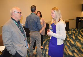 Brian Zomorodi, vice president of quality and food safety for Apio Inc., Guadalupe, Calif., visits with Danielle Gilmartin, senior operations manager for New York-based HelloFresh at a reception at the 2018 freshPACKmoves conference May 22 in Monterey, Calif.