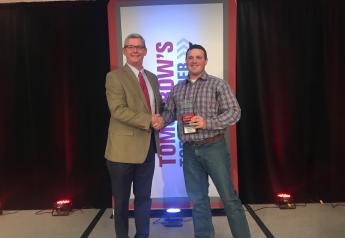 Mark Timke, national strategic account manager for Pioneer (left), congratulates Anthony Schwarck of Schwarck Farms in Riceville, Iowa, for being named the 2019 Tomorrow’s Top Producer Horizon Award winner at Farm Journal Media’s Top Producer Seminar in Chicago.