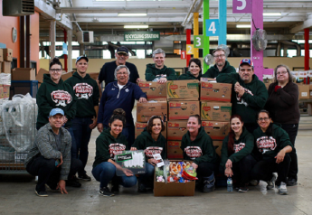 Members of the Ontario Produce Marketing Association and  Toronto Wholesalers Produce Association volunteer for the 2018 Christmas Foodshare program.