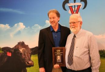 Dr. Andy Johnson (right) has consulted in 32 countries and 46 U.S. states, on dairies ranging from 20 to over 20,000 cows.