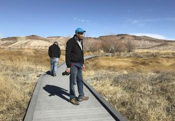 Len Warren, right, and John Zablocki from the The Nature Conservancy stand on the boardwalk at the Torrance Ranch Preserve north of Beatty, Nevada on Feb. 8, 2019. 