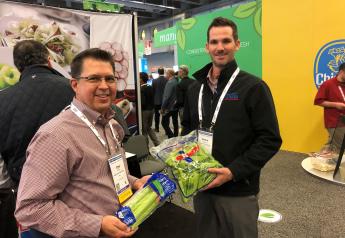 Tim Ross (left), director of regional sales for Duda Farm Fresh Foods, Salinas, Calif., and Mason Hamilton, account manager for the company, display celery at the 2019 CPMA Expo Floor.