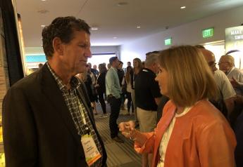 Tim York,  president of Markon Cooperative visits with Julie Krivanek,  president of Krivanek Consulting, Denver, Colo. on July 27 at Produce Marketing Association's Foodservice Conference and Expo in Monterey.