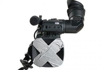 Stock photo of a camera being covered up. 