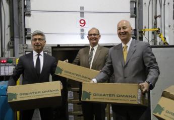 Henry Davis with Greater Omaha, NDA Director Greg Ibach and Governor Pete Ricketts with boxes of beef destined to China on June 14, 2017