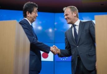 Shinzo Abe, Japan's prime minister, left, greets Donald Tusk, president of the European Union, ahead of a news conference at the European Council in Brussels, Belgium, on March 21, 2017.