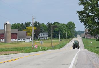 Tractor_Driving_Down_the_Road_in_Wisconsin_Farm_Land_FINAL