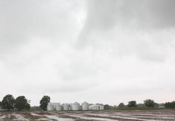 farm-grain-bins-wet-field