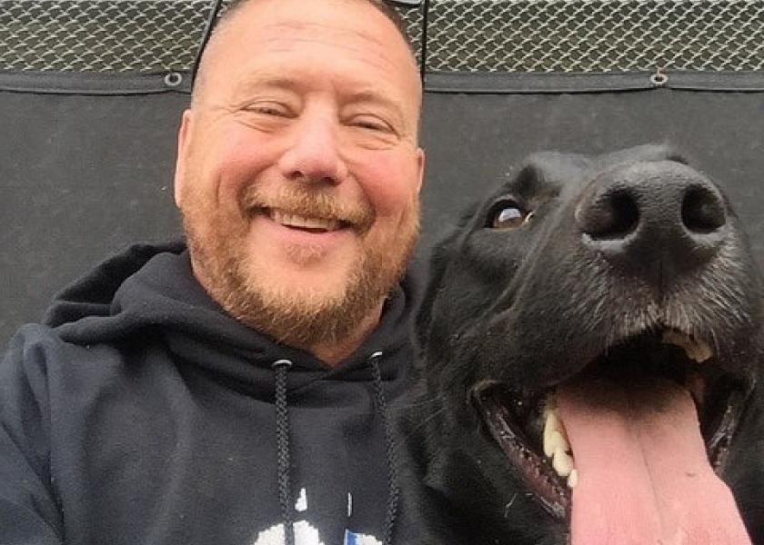 Colorado State University researcher Dr. Glen Golden and Odin taking a break from detector dog training.
