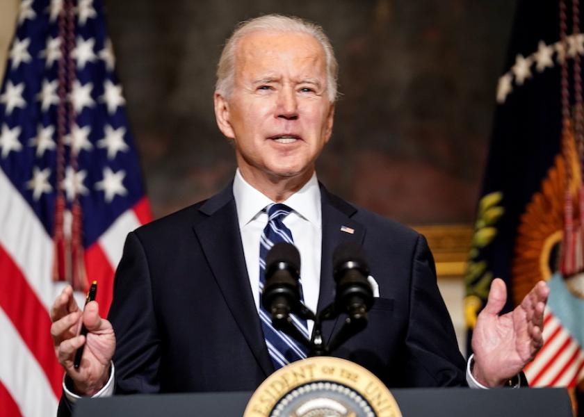 FILE PHOTO: U.S. President Joe Biden delivers remarks on tackling climate change prior to signing executive actions in the State Dining Room at the White House in Washington, U.S., January 27, 2021. REUTERS/Kevin Lamarque