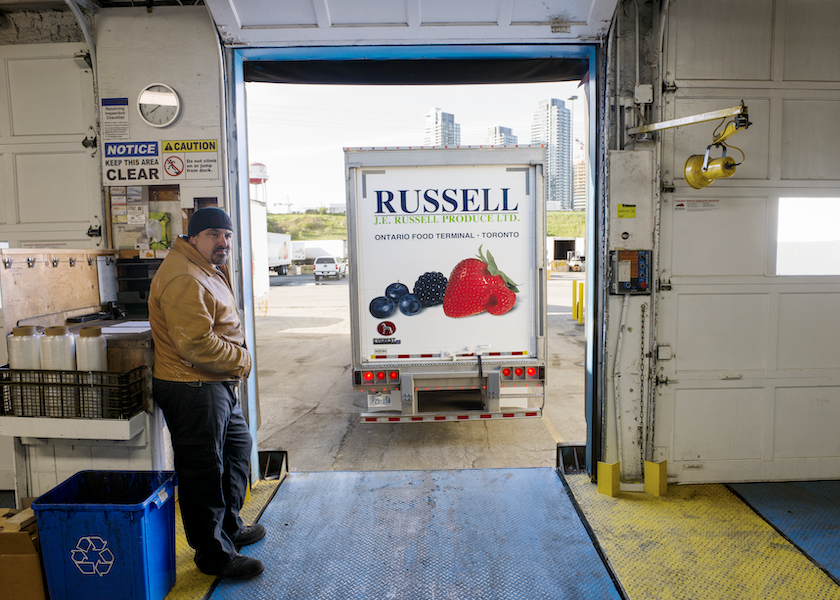 Shot before the pandemic began, John Melo waits for the truck arriving at the loading dock of J.E. Russell Produce Ltd. at Ontario Food Terminal in Toronto.