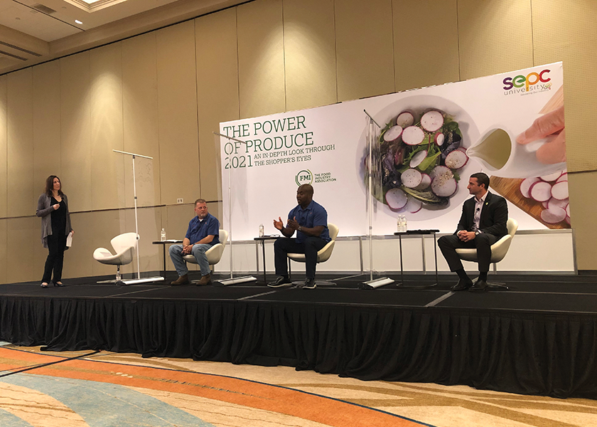 Anne-Marie Roerink of 210 Analytics discusses the findings in the new Power of Produce report with Mike Roberts of Harps Food Stores (left), Gary Baker of Merchants Distributors (middle) and Price Mabry of HAC (right).