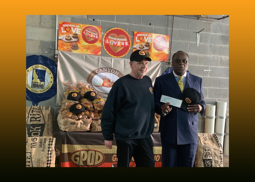 Bronx, N.Y.-based Canyon Sales Co. president Louis Getzelman Sr. awarded the top GPOD of Idaho potato display contest prize to the Rev. W. Franklyn Richardson, whose mother started the Mount Vernon, N.Y.-based Grace Baptist Church food pantry 36 years ago.