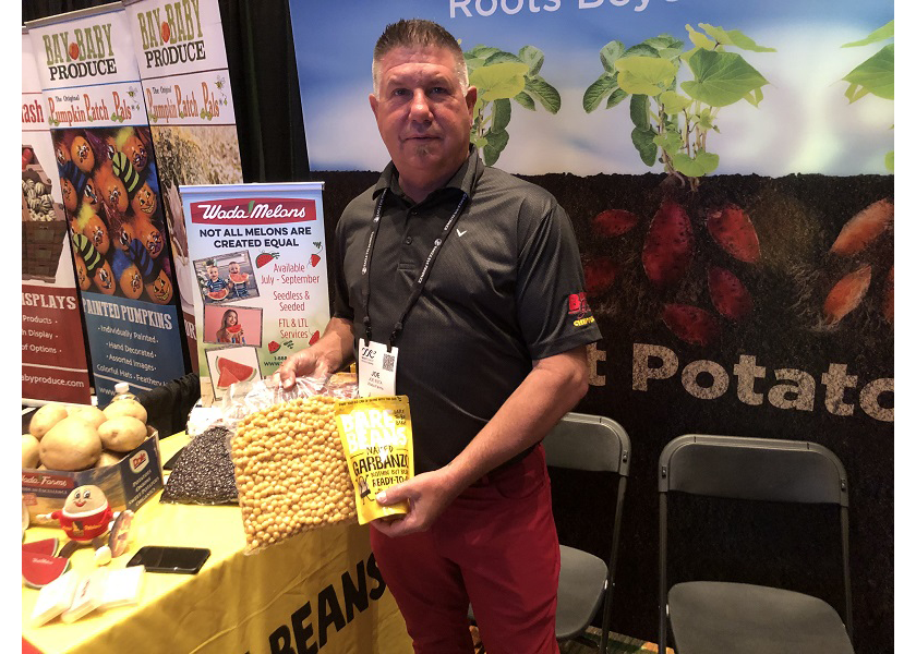 Joe Esta, vice president of the Idaho Falls, Idaho-based Wada Farms, displays beans at the West Coast Produce Expo.