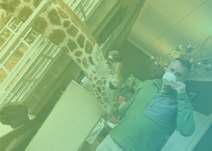 Kevin Moffitt, president and CEO of Pear Bureau Northwest, pictured here with a giraffe on his world travels, shares the opportunity the produce industry should take advantage of, his most memorable project and what new skill we should try.